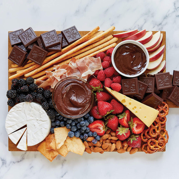 AMERICAN HERITAGE Chocolate Tasting Squares - Lifestyle Image of a charcuterie board with tasting squares, fruit, cheese, and nuts