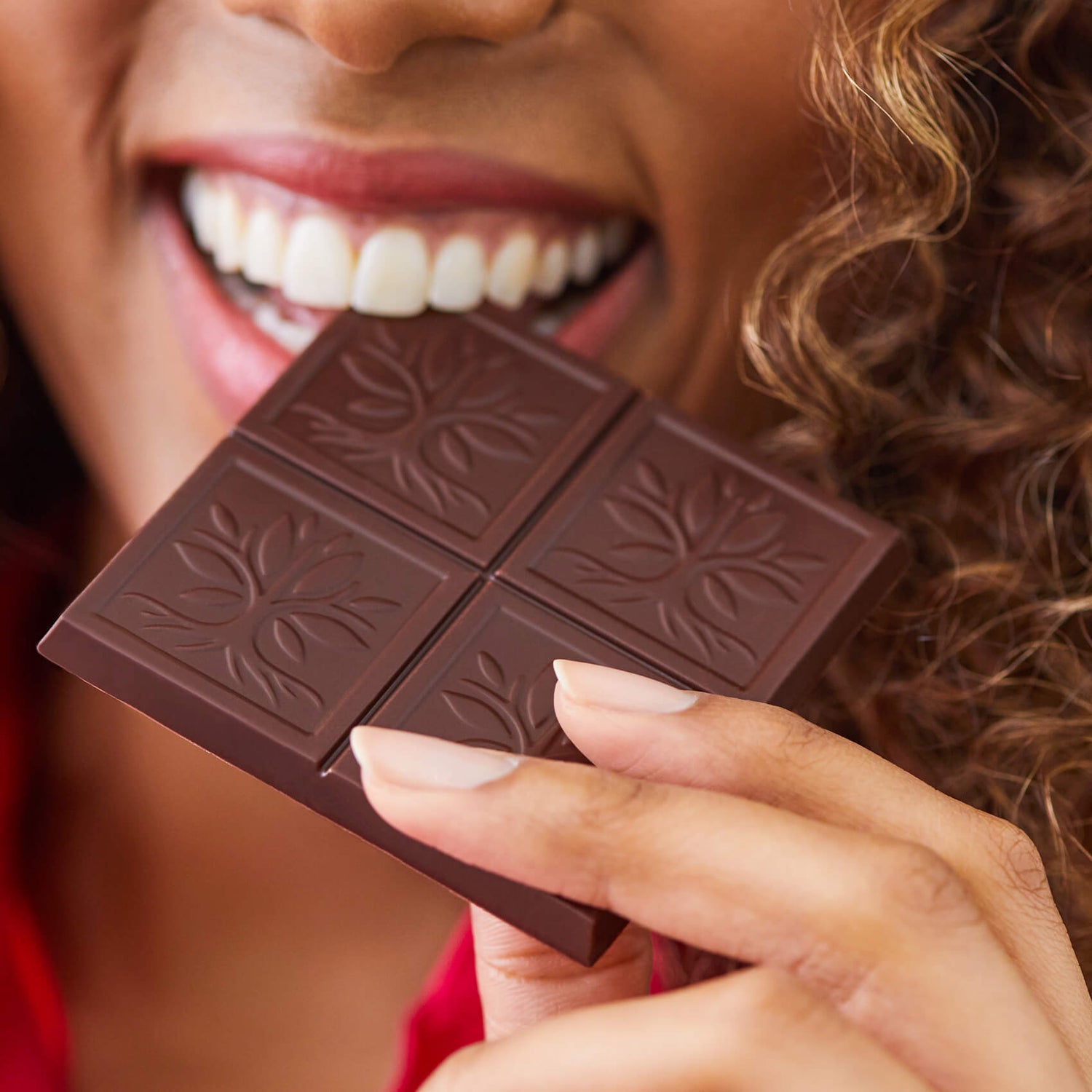 Woman Eating an AMERICAN HERITAGE Chocolate Tablet Bar