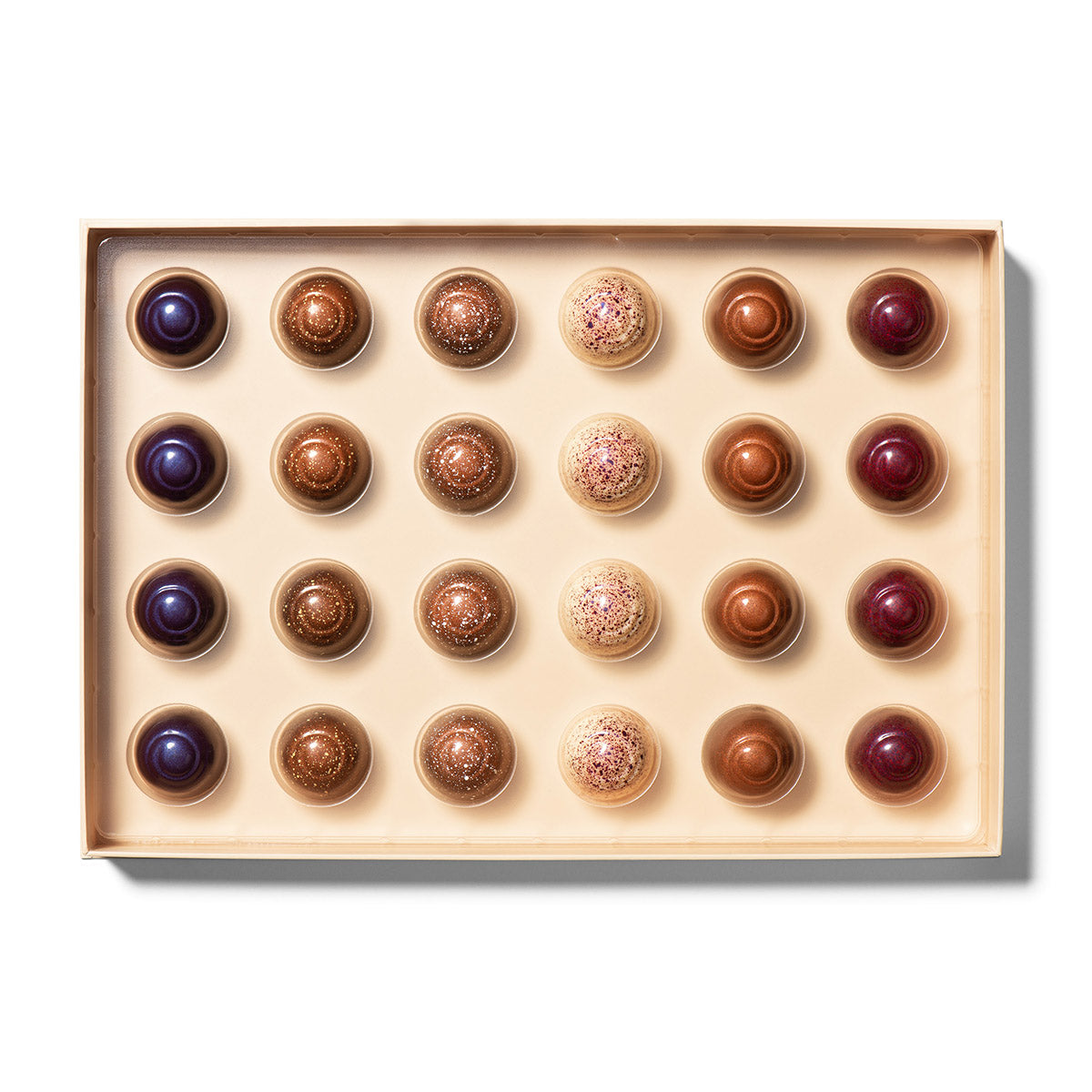 Ethel M Chocolates 24-piece Truffles Collection Lifestyle Open Box Image - Shows the truffles inside the box.