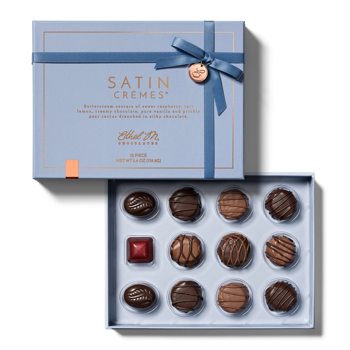 A 12pc Box filled with Ethel M Chocolates' Exquisite and Fresh Satin Crème pieces including Lemon, Prickly Pear, Raspberry, Vanilla, and Chocolate.